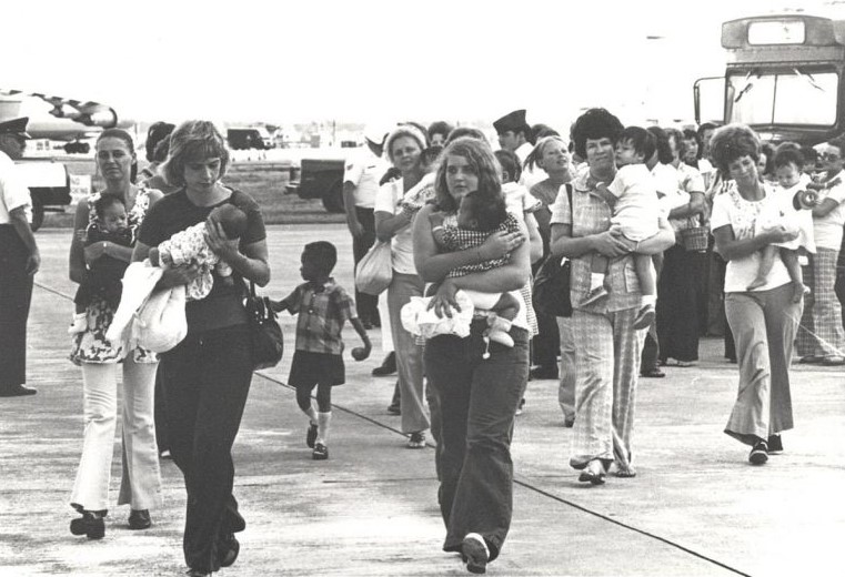 Saigon orphans from buses to US bound C 141 transports Apr 1975
